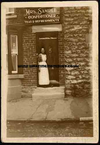 <p>Fred Sample's parents Louisa & James in door of their cafe,used during the war by soldiers recuperating at Welburn Hall near to Kirkbymoorside. 